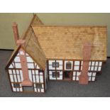 An unusually large mock Tudor dolls farmhouse,