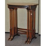 A mahogany nest of three tables, of oval form with inlaid detailing,