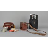 A collection of assorted cameras, including a Kodak Brownie,