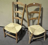 Two 20th century low wicker seated chairs, 101cm high,