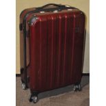 An 'Eminent' lockable suitcase on four wheels