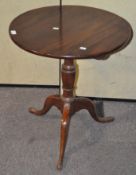 A 19th century mahogany tilt top table, on tripod support,