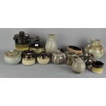 An assortment of mixed Studio pottery, including lidded dishes,