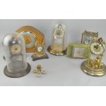 A group of clocks, including a Smith's mantel clock,