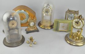 A group of clocks, including a Smith's mantel clock,