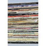 A collection of vinyl LP's including rock and jazz.