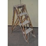 A set of vintage wooden step ladders,