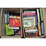 Two boxes of books, including novels,