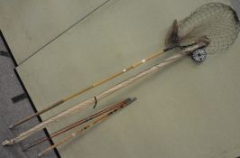 A group of fishing items, including rods, reels,