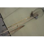 A group of fishing items, including rods, reels,