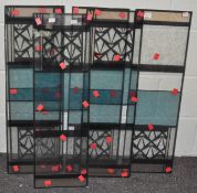 A group of six decorative glass panels, of rectangular form,