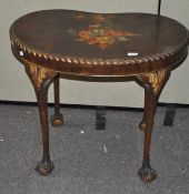 A kidney shaped occasional table, with painted floral scene to top, raised upon claw and ball feet,