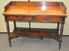 A Victorian mahogany washstand, with two drawers to front, raised on turned supports,