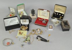 A collection of clocks and jewellery
