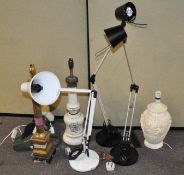 A group of assorted table lamps of varying shapes and designs