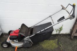 A Honda GXV160 petrol lawn mower with fitted grass collecting bag
