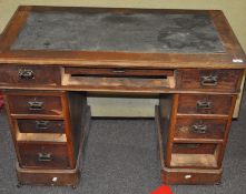 A late 19th/early 20th century, oak twin pedestal desk,