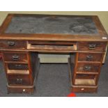 A late 19th/early 20th century, oak twin pedestal desk,