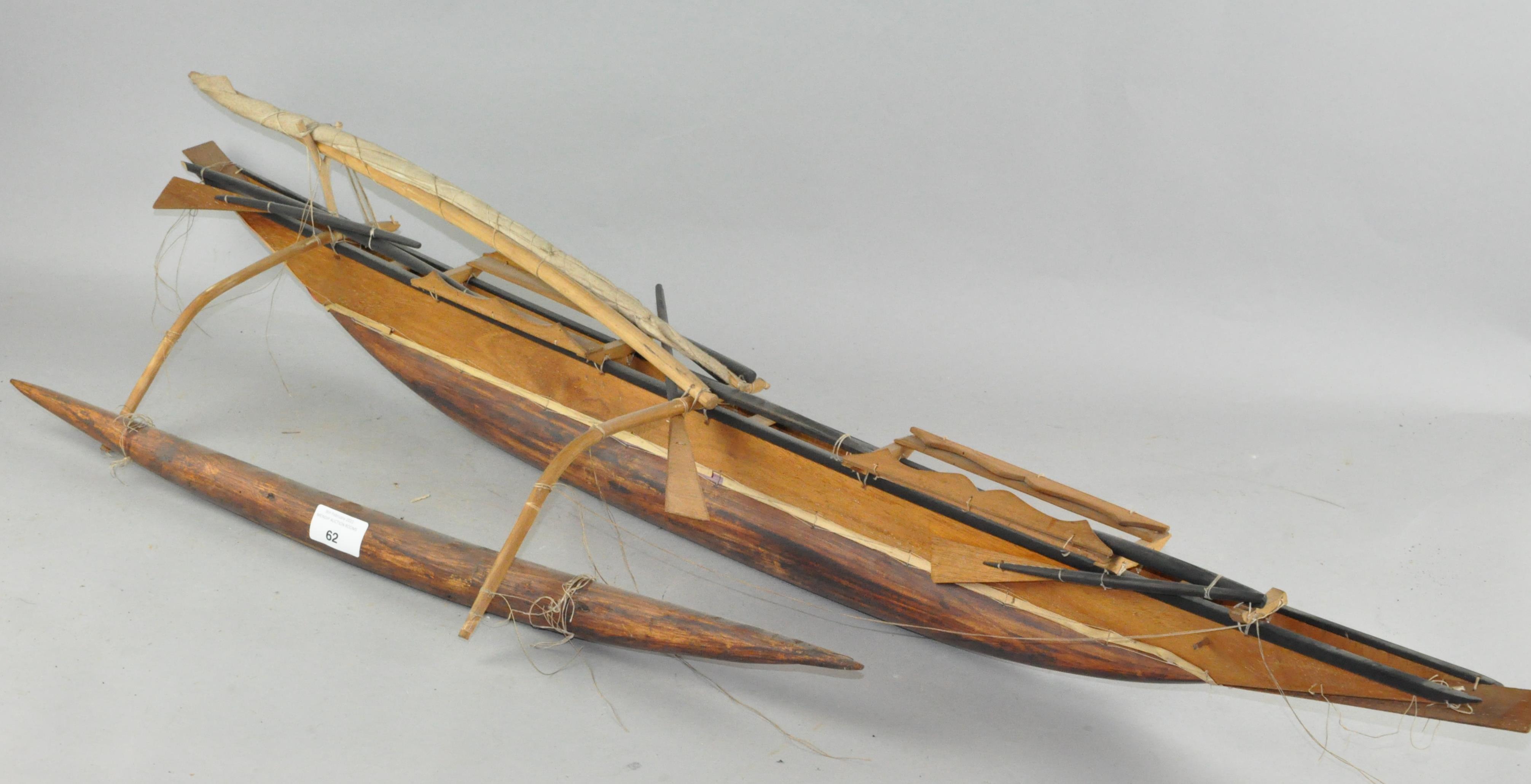 A scratch built wooden model of a boat,