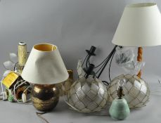 A collection of lighting items including table lamps and a three branch chandelier