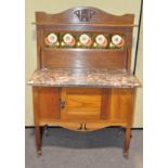 An oak and tile back marble top wash stand, raised on four castors,