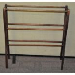 An Edwardian mahogany towel rail,