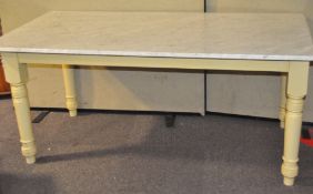 A large 20th century marble top dining table, with painted base,