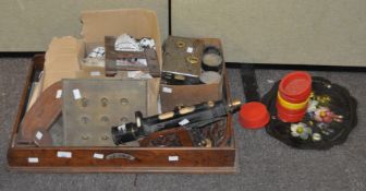 A large group of collectables, including a pair of book ends, a theodolite,