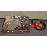 A large group of collectables, including a pair of book ends, a theodolite,