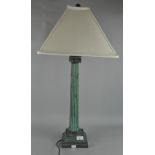 A metal table lamp of Ionic column form, with shade,