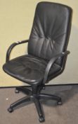A modern black faux leather office chair,