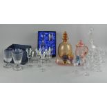 A collection of assorted glassware, most drinking glasses,