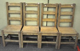 A set of four oak dining chairs,