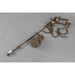 A 19th century cast iron sack weight with two large and two small hooks and a globular weight,