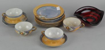 A Japanese "eggshell" porcelain part tea set, comprising tea cups, saucers and side plates,