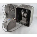 A Bell and Howell Model 615 projector and transformer,