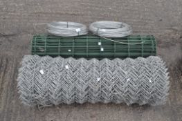 A heavy roll of wire fencing,