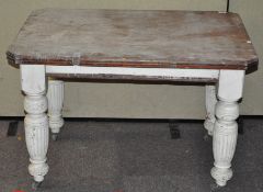 A Victorian painted small dining table, raised on four turned legs,