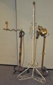 A group of three standard lamps, one having previously been an oil lamp,
