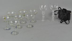 A collection of Babycham and other drinking glasses