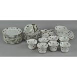 A 'Union K' porcelain part teaset, decorated with grapes, including teacups, saucers,