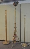 Three lamps, including two brass standard lamps and a gilt wood example,