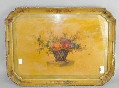 A Victorian papier mache drinks tray, with floral scene adorning the front,