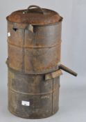 An iron honey separator, in two parts, with spout to one side,
