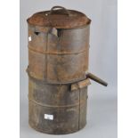 An iron honey separator, in two parts, with spout to one side,