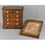 A table top apprentice chest of drawers, two short and three long drawers,