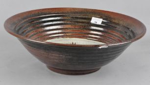 A large Art pottery bowl/charger,