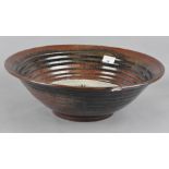 A large Art pottery bowl/charger,