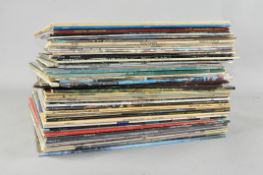 A box of assorted vinyls, including Jean Michael Jarre,