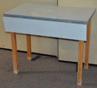 A vintage drop leaf dining table,